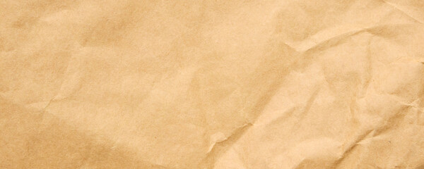 Abstract crumpled and creased recycle brown craft paper texture background