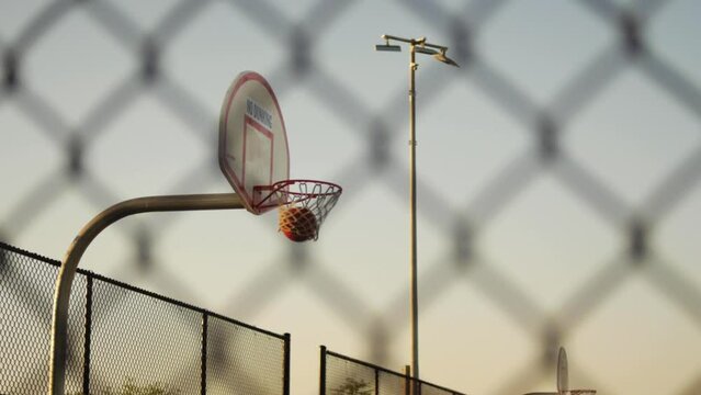 Basketball hoop with ball being shot into the net without touching rim