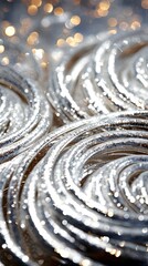 Fototapeta na wymiar Tinsel christmas twirl. A dynamic close-up capturing the shimmering effect of christmas silver tinsel decorations. Jewellery, gem, fashion glamorous event card. Vertical orientation. 