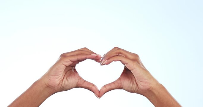 Woman, heart hands and love for care, support or trust with symbol or icon against a studio background. Closeup of person showing shape emoji, sign or like for romantic gesture on mockup space