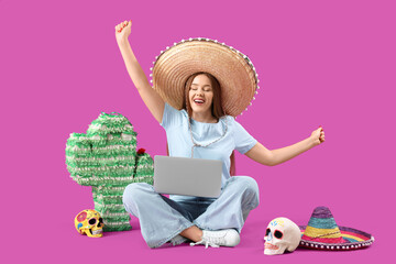 Young woman in sombrero hat with laptop and Mexican symbols on purple background