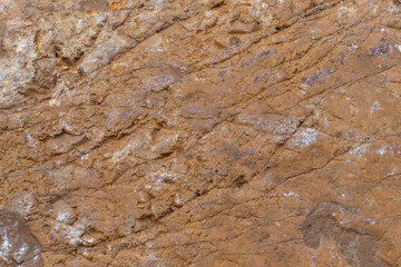 Texture, stone surface. Brown background.