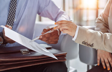 Lawyer, broker or HR manager signing a contract agreement with client or employee.