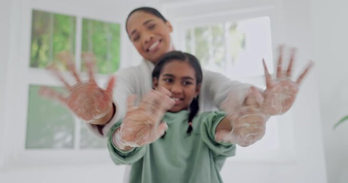 Face, mother and child washing hands, soap and wave for wellness in home bathroom. Portrait, happy and mom and kid cleaning with foam, learning hygiene and education in health to stop bacteria germs