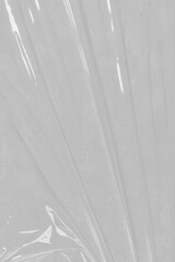 Crumpled plastic warp. Grunge plastic wrap on white background. Texture transparent stretched film polyethylene