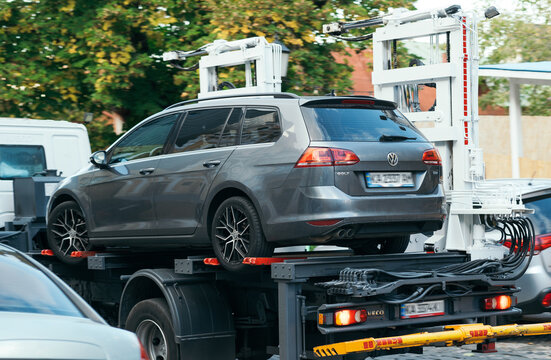 Kyiv, Ukraine - 17 october, 2023.  Loading car Volkswagen Golf on to tow truck. Evacuation of the parking intruder's car close-up 