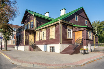 example of hundred-year-old historical old wooden building and homestead of private sector in wooden constructivism style - obrazy, fototapety, plakaty