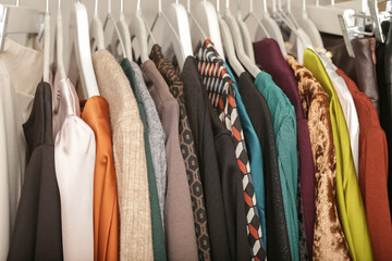 Women's fashion. Different clothes on hangers, close up. Huge selection of different used womens...