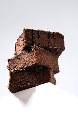 Chocolate brownie portions on gray background
