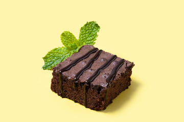 Chocolate brownie portions on yellow background