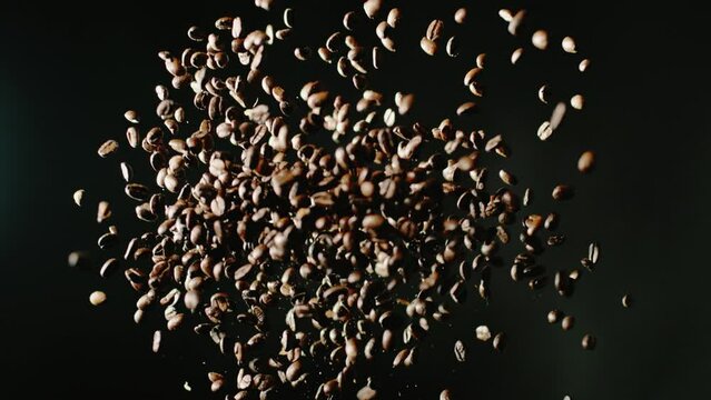 The coffee beans are thrown into the air