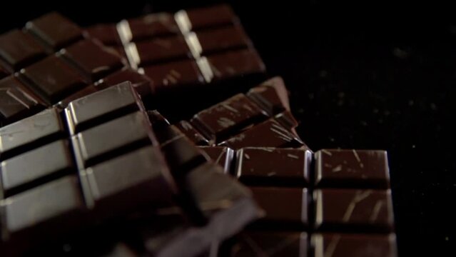 Bars of chocolate fall into a pile