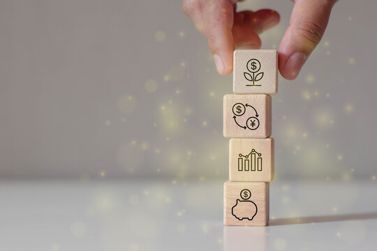 Hand stack woods block step on table with icon business target concept.Company strategy development.