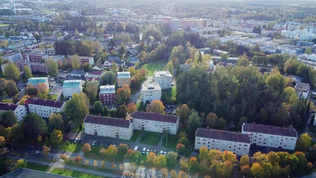 Aerial flies over autumn apartment blocks in Scandinavian city, Kerava