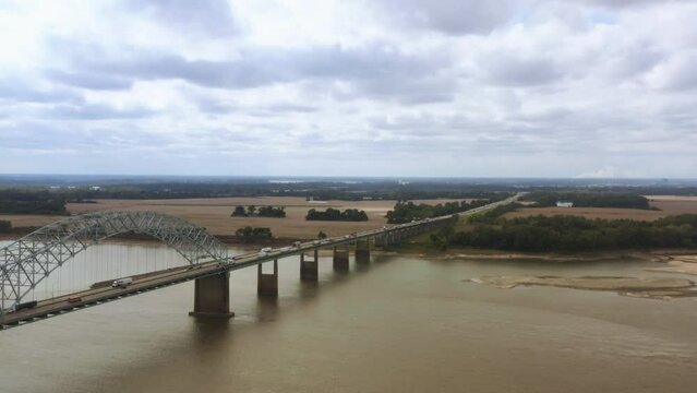 An aerial shot of the Hernando de Soto Bridge, Interstate 40, the Mississippi River, West Memphis, Arkansas, and Memphis, Tennessee.