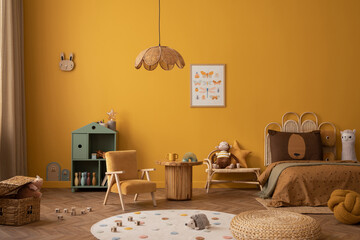 Cozy composition of child room interior with mock up poster frame, yellow wall, braided bed, plush pillows, toys, blocks, braided pouf, monkey, lama and personal accessories. Home decor. Template.