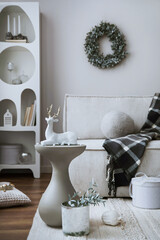 Amazing composition on white design shelf with christmas decoration, lights, gifts, lanterns ,deer,...