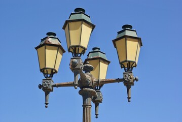 Fototapeta na wymiar Historical metal street lantern in Faro, Algarve - Portugal