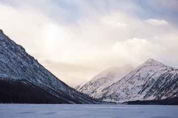 Fototapeta na wymiar Snow-covered winter mountain lake, Russia, Siberia, Altai mountains. Multinskie lakes.