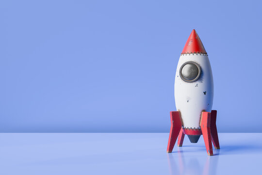 Rocket toy on blue background