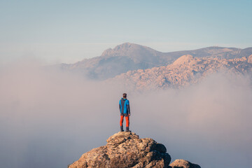 Silhouette of a man on top of the mountain