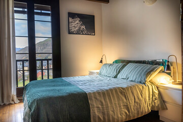 Cozy bedroom with mountain town view