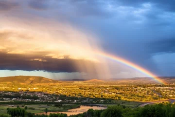 Zelfklevend Fotobehang a rainbow appearing after a storm © altitudevisual