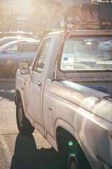 Oldtimer rust pickup at sunset with lensflare