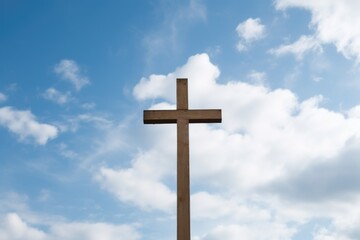 wooden cross against a cloudy sky