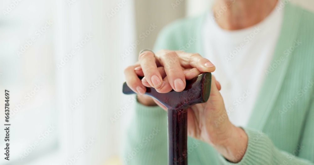 Wall mural Cane, retirement and support with hands of old woman for cancer, medical and person with a disability. Rehabilitation, healthcare and walking stick with closeup of person in nursing home for balance