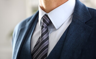 Male arm in blue suit set tie closeup. White collar management job serious move secretary student...