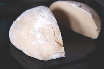 Whole grain fresh baked bread on the black background