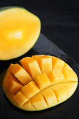 Sliced ​​mango close-up on a dark background