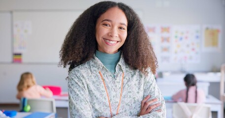 Female teacher, arms crossed and smile in class with school kids, pride or happy for education career. Woman, classroom and learning expert for children, face or portrait with development for future