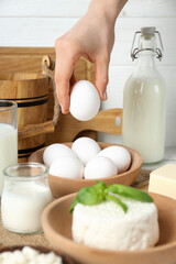 Cooking food from dairy products, with hands.
