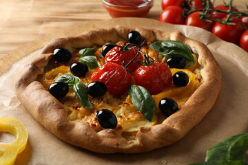 Freshly baked vegetable galette on a wooden table