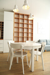 A table with chairs in the kitchen