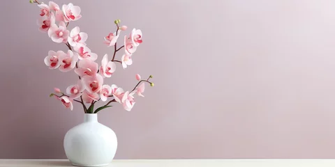 Gordijnen Vase with orchids on the wall, copy space, mockup © Svitlana