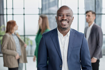 Handsome african american executive businessman in modern office