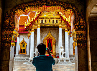 Capturing Memories: Tourist Photographing Temple in Bangkok, Thailand