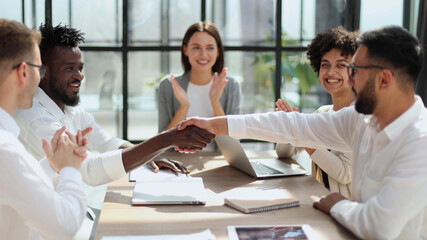 Fototapeta premium Congratulating the new partners in modern office