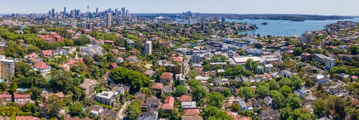 Panoramic aerial drone view above the harbourside suburb of Double Bay in east Sydney, NSW Australia looking toward Darling Point, Sydney Harbour and Sydney City on a sunny day - obrazy, fototapety, plakaty