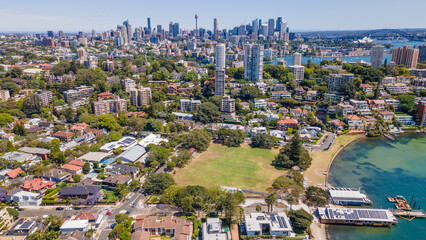 Fototapeta na wymiar Aerial drone view above the harbourside suburb of Double Bay in east Sydney, NSW Australia looking toward Darling Point, Sydney Harbour and Sydney City on a sunny day