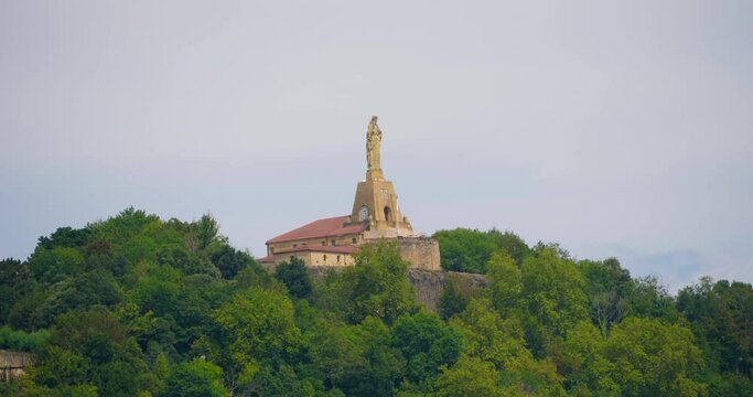 San Sebastian Christus statue overlooking stunning city harbor in Spain