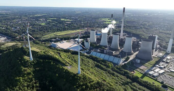 Aerial drone view of a large fossil fuels hard coal power plant in Germany. Generation of energy by burning fossil fuels.