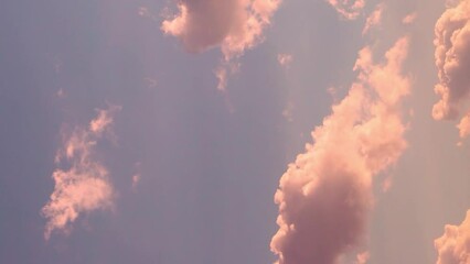 Vertical. Gentle Colorful Sunrise Sky with Peach Pink Puffy Clouds in Sunlight. Beautiful Blue Lilac Sky with Colored Clouds at Dawn. Airplane Window, Aerial Shot, Time Lapse of Clouds. Background 4K. - Powered by Adobe