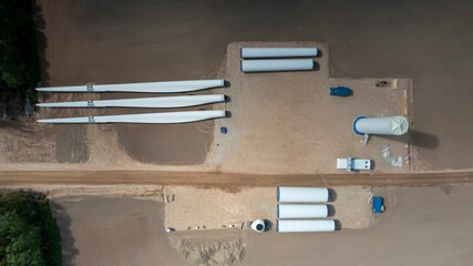 Aerial view of a wind farm in Southern Estonia with the construction works and assembly parts