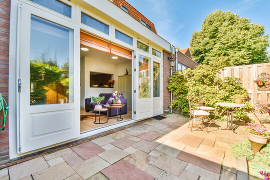 Backyard with furniture and plants outside modern house