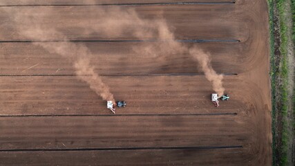 Aerial view of a peat extraction field with harvesting machinery in Viljandi County, Estonia