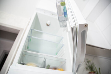 Torn and damaged sealing gum on the refrigerator door. Replacing the old sealing rubber with a new...